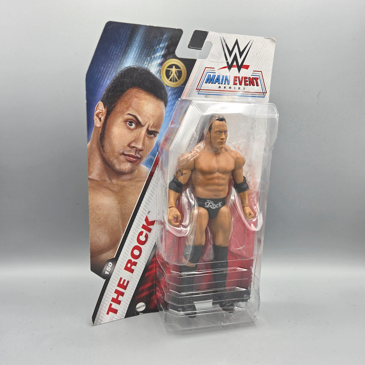Mattel	#150 The Rock	Main Event Series	WWE	Sammelfigur